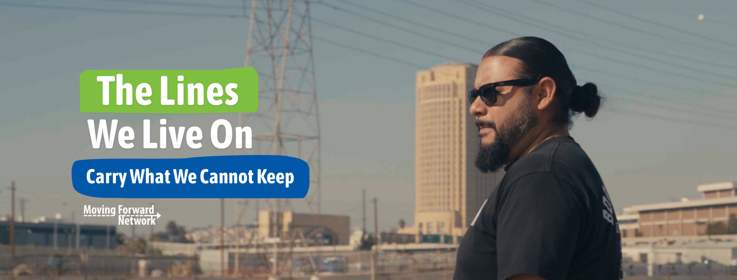 mark! Lopez wearing black sunglasses and a black shirt standing in front of the East Yard in Los Angeles. Text over it reads "The Lines We live On, Carry What We Cannot Keep" featuring Moving Forward Network's logo.